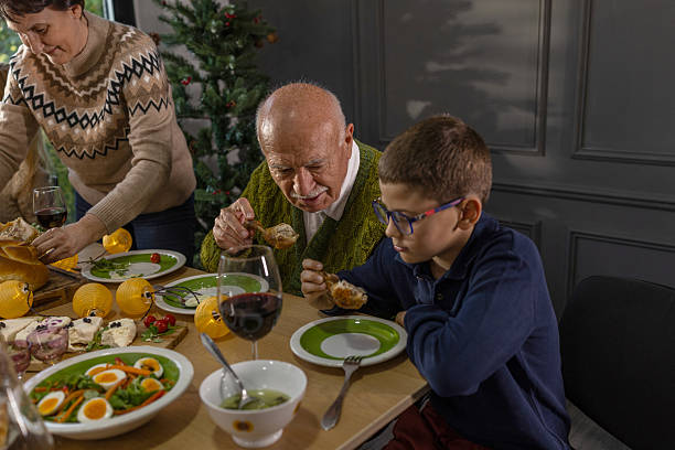 istock Family Enjoying a Holiday Meal Around a Festive Table Setting 2233163757