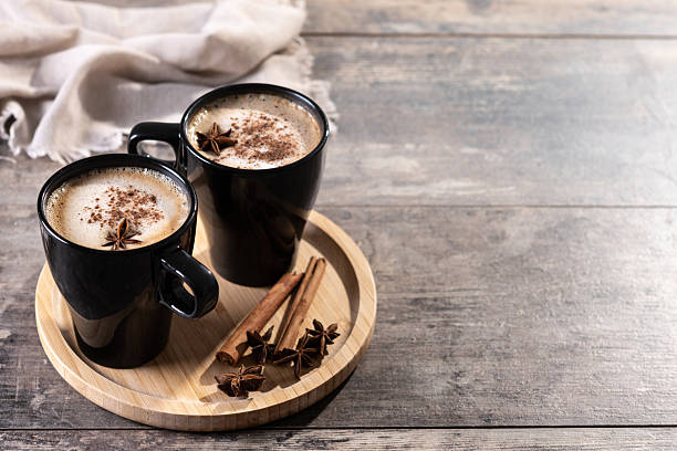 istock Chai Latte in Black Mug with Spices( star anise and cinnamon) on wooden table 2233165129