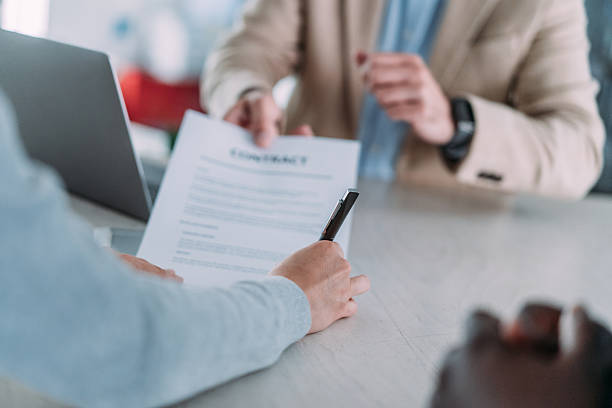 istock Business people signing a contract in the office. 2233165248
