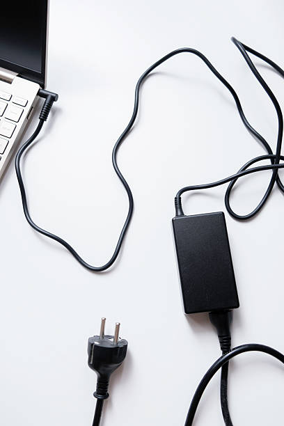 istock Laptop battery charger adapter isolated on white background 2233167377