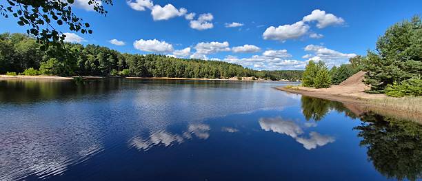 istock View of the lake and clouds reflecting in it. 2233168236