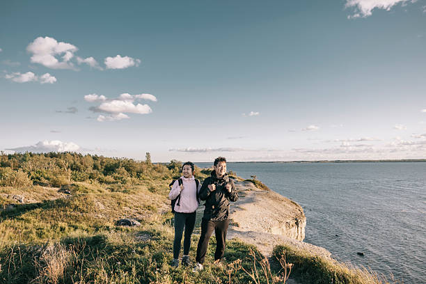 istock Couple enjoying a scenic coastline while hiking on a sunny day 2233169503