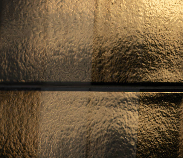 istock Dreamy Abstract Background of Light Through Textured Glassv 2233171987
