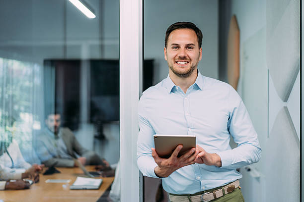 istock Confident businessman and his team. 2233172837
