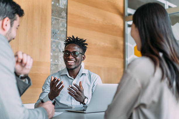istock Group of business persons talking in the office. 2233172876