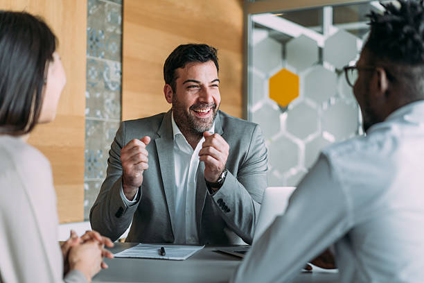 istock Group of business persons talking in the office. 2233172877