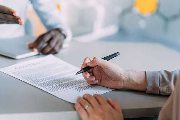 istock Business people signing a contract in the office. 2233172895
