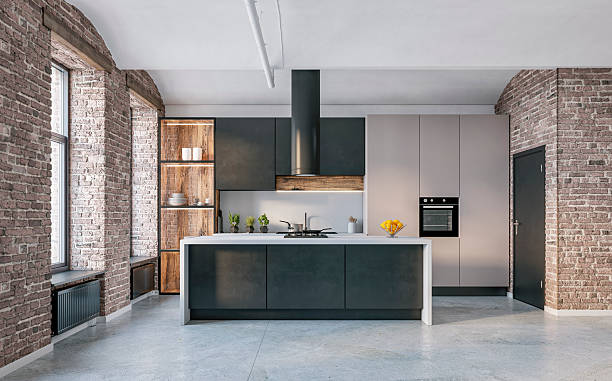 istock Modern industrial-style kitchen interior, brick walls, beige and black cabinets, large windows, kitchen island on cement floor 2233173920