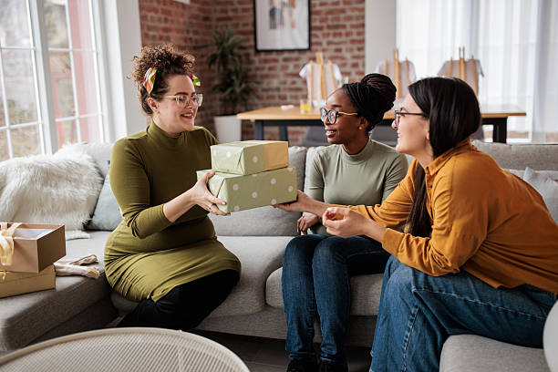 istock Future mom delighted by baby shower gifts 2233175272