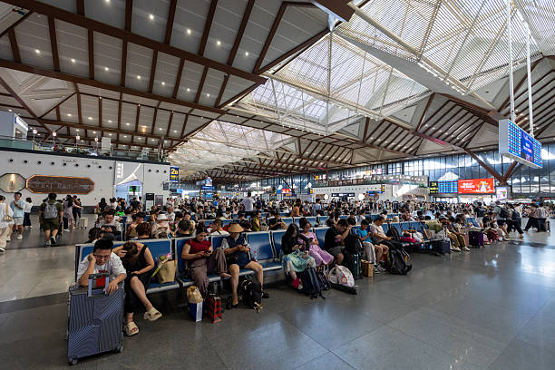 Suzhou, China - August 14, 2025 : People at the Suzhou Railway Station in Suzhou, China.