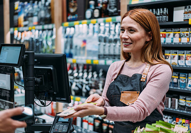 istock Man using phone to make the payment at the supermarket 2233180111