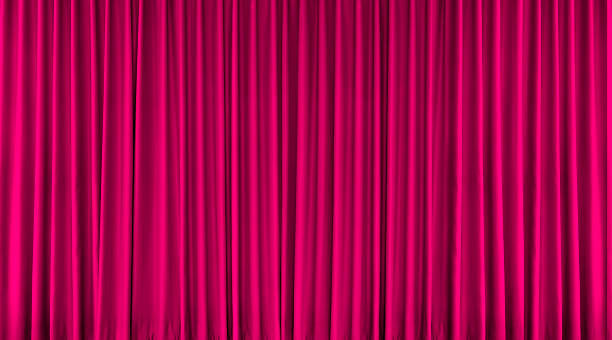 istock Long pink curtain for background. 2233180796