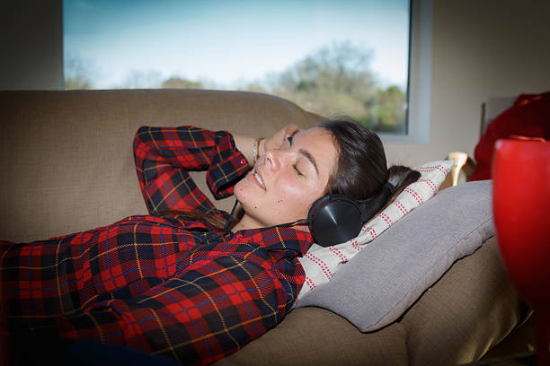 istock woman lying on the couch 2233181759