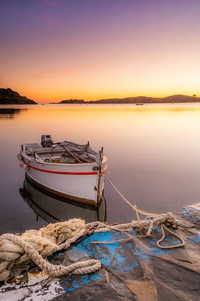 istock Serene sunset with a boat at the dock. 2233181996