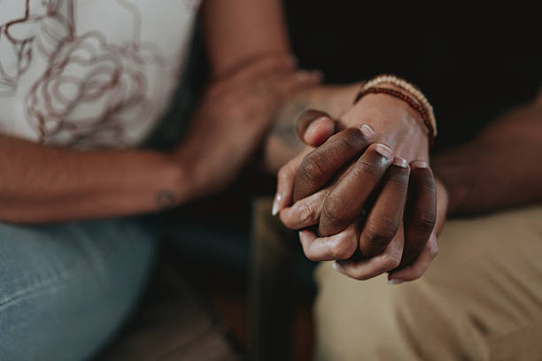 istock Couple holding hands detail 2233183907