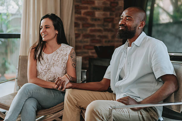 istock Couple talking sitting on the living room sofa 2233183957