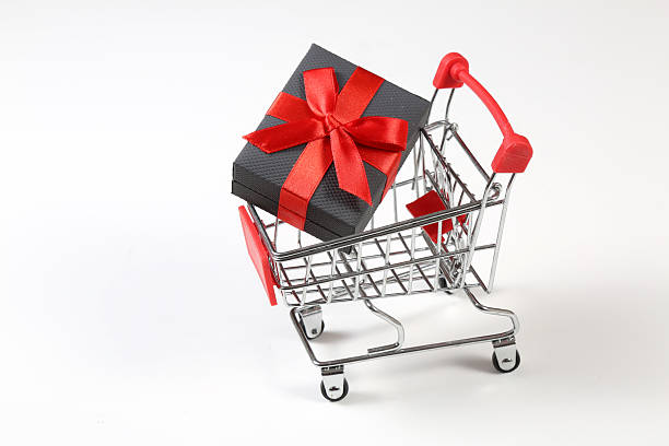 istock Toy shopping cart with Christmas gift 2233184214