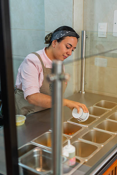 istock Restaurant owner gets ready to open the doors and start serving customers 2233185403