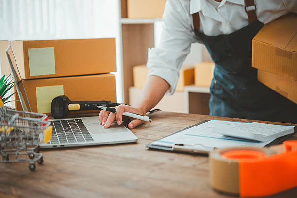 istock Small SME business owners work with laptop computers at work. and have products ready to ship. customers have ordered of online retailers,Ecommerce 2233185501