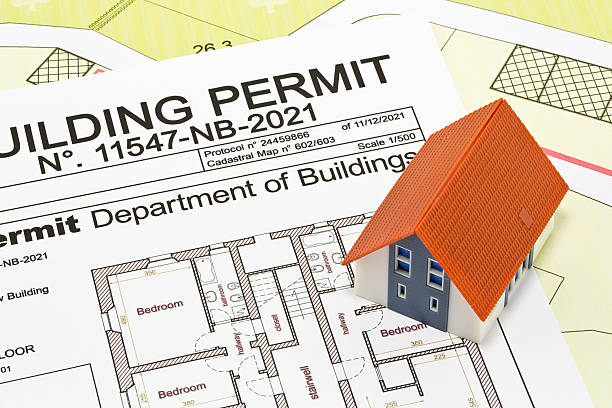 istock Building Permit concept with imaginary building approvation and residential home model 2233185786