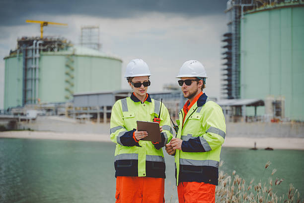 istock Oil and Gas Engineers Using Tablet for Site Communication and Project Coordination 2233186235
