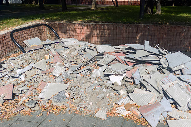istock Pile of broken pavement tiles and rubble at construction site 2233188159