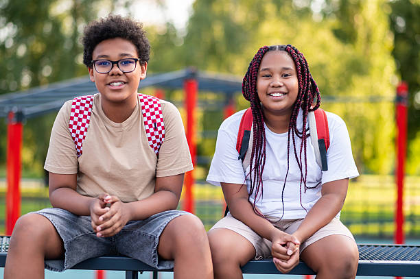 istock Teens sitting at the playground after school and talking 2233189188