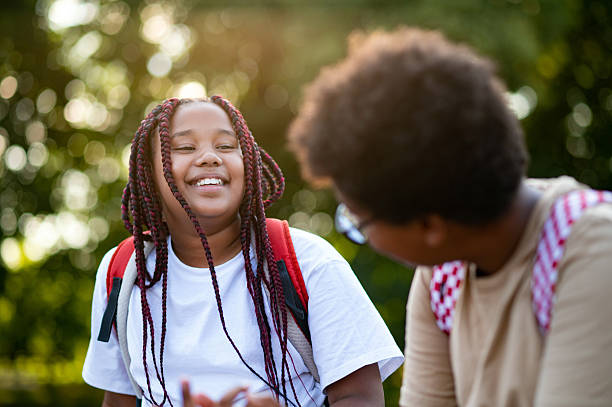 istock Teens sitting at the playground after school and talking 2233189199