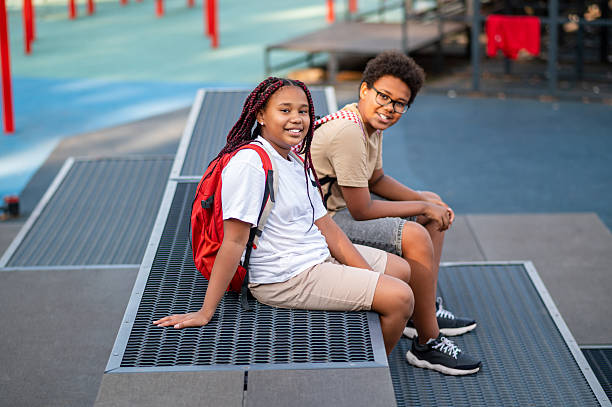 istock Two teens at the playground looking contented and relaxed 2233189204