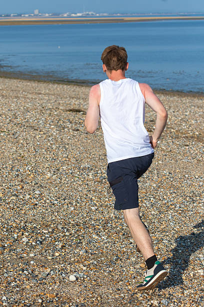 istock Teen Jogging on a beach 2233189981