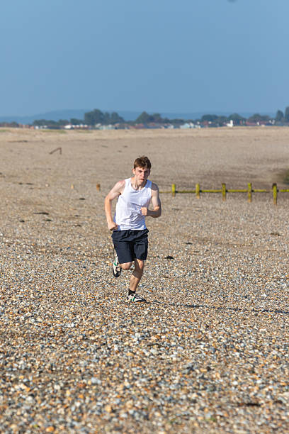 istock Teen Jogging on a beach 2233190153