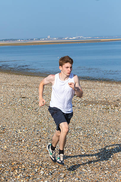 istock Teen Jogging on a beach 2233191342