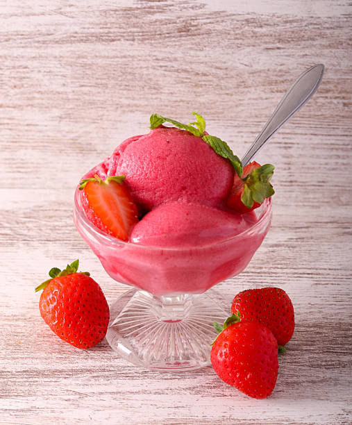 Strawberry sorbet scoops, served