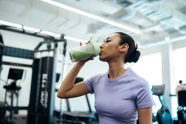 istock Asian athlete drinking health shake after training session 2233200718