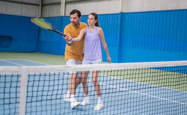 istock Female Tennis Player With Coach 2233201028