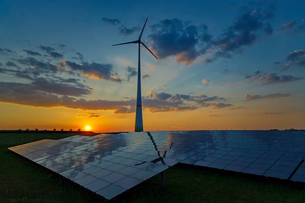 istock Solar panels and wind turbine at sunset showcasing renewable energy sources 2233204297