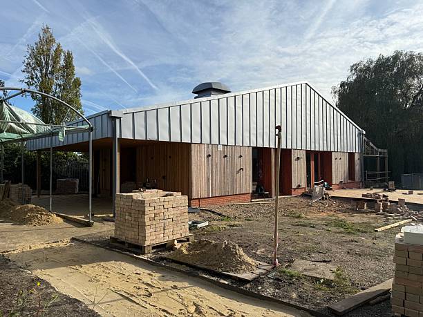 istock Modern Building Construction with Metal Roof and Wooden Cladding. 2233204957