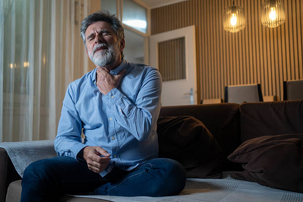istock Terrible pain in his throat 2233206779