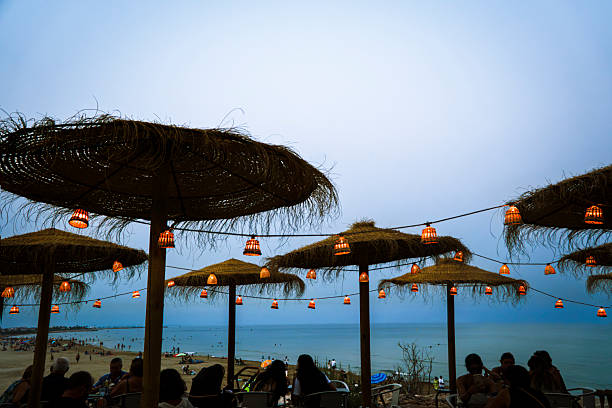 Relaxing on a seaside terrace at nightfall