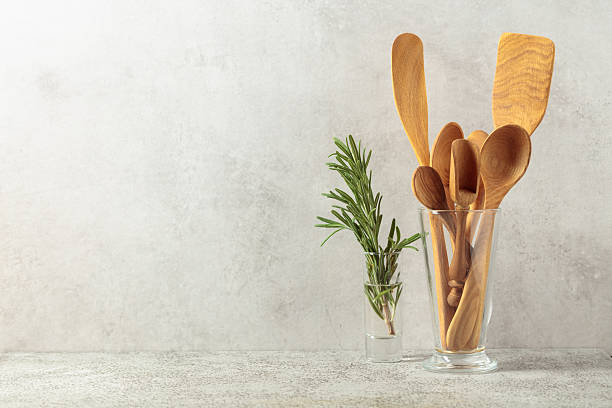 istock Wooden kitchen utensils and rosemary. 2233209174