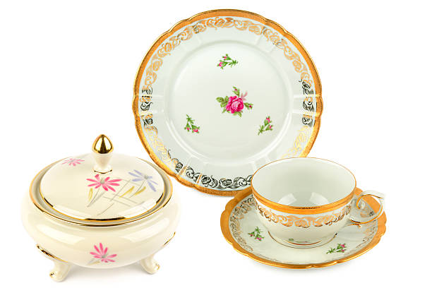 istock Vintage sugar bowl, tea cup, and plate with gold trim and floral patterns 2233213662