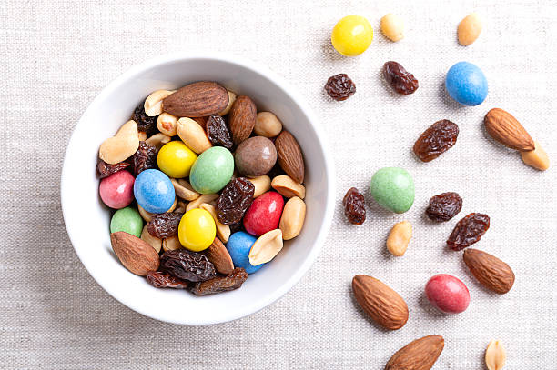 istock Rainbow trail mix, a snack nut mix in a white bowl on linen 2233215764