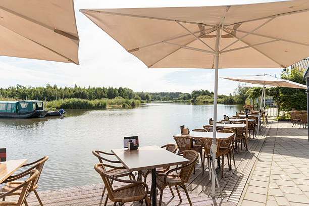 istock An empty public canal side cafe on a sunny day in the Netherlands 2233223663