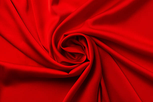 istock Red silk satin folded into the shape of a rose flower 2233224280