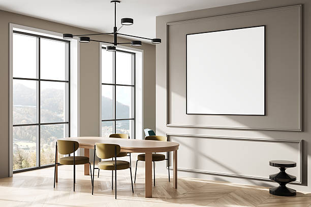 istock Modern dining room interior with large blank poster frame on beige wall and natural light from windows, perfect for design mockup or template display. 3D Rendering 2233237531