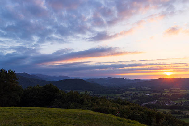 istock Colorful sunset illuminating rolling hills and valleys 2233240349