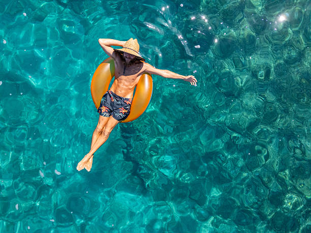 istock Best summer vacay, man relaxing in crystal clear bay 2233242339