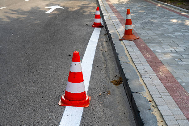istock Construction work in progress with traffic cones marking off a roadway in a city environment during daylight hours 2233242976