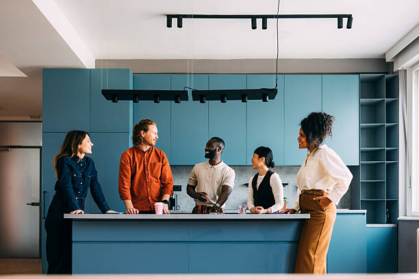 istock Diverse Friends Talking in a Modern Kitchen with Bright, Contemporary Design 2233243106