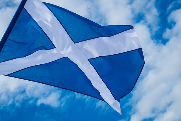 istock Scottish Flag Waving in the Sky 2233243137